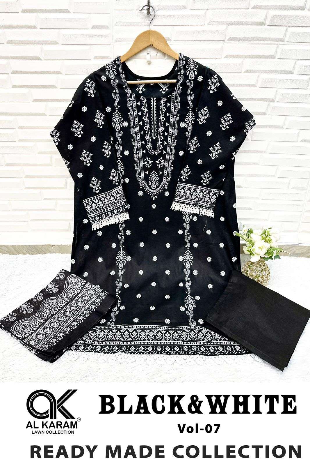 BLACK AND WHITE  STICH SUITS READY WEAR BY AL KARAM